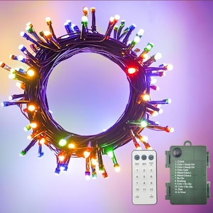 May include: A circular coil of dark wire featuring multi-colored LED lights in red, blue, green, yellow, and white. Included is a rectangular remote control with twelve numbered buttons and a green battery pack with printed light mode settings.