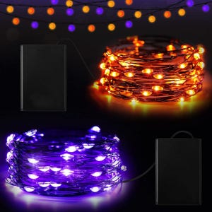 May include: Two sets of LED string lights with black battery packs. One set features glowing orange lights on a dark wire, while the other set features glowing purple lights on a dark wire. Both are shown coiled, with additional lights hanging above.