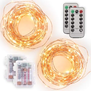 May include: Two coils of warm white LED fairy lights on thin copper wire, accompanied by two rectangular battery packs with printed mode lists and two remote controls featuring numbered buttons for light settings and dimming functions.