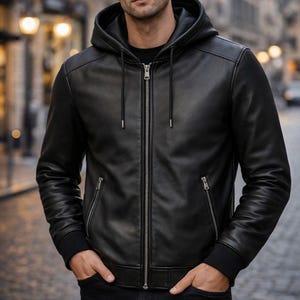 Front view of men's black genuine leather hooded jacket with zip closure