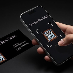 May include: A smartphone displaying a QR code, with the text "Book Your Ride Today!" on the screen. A business card with the same text and a QR code is next to the phone. The background is black.