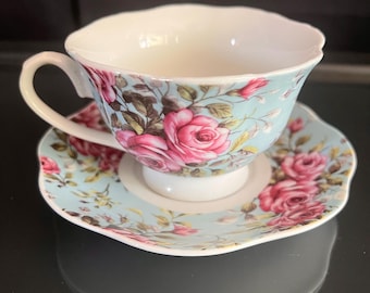 Vintage European Style China Teacup and Saucer with Pink Roses on Baby Blue Background