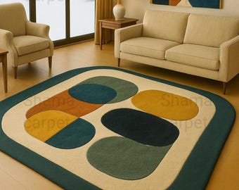 May include: A modern area rug with a geometric design. The rug features a cream-colored background with large, colorful oval shapes in shades of teal, mustard yellow, orange, and dark green, framed by a dark teal border. The text "Shama carpet" is visible.