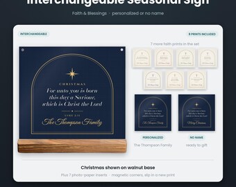 May include: An interchangeable seasonal sign featuring a dark blue rectangular print with gold arch graphics, a star, and the text For unto you is born this day a Saviour, which is Christ the Lord. It sits on a rectangular walnut wood base.