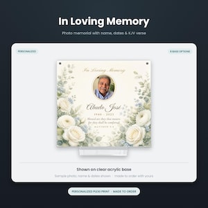 May include: A square memorial plaque on a clear acrylic base featuring a central oval photo of an older man, the text In Loving Memory, Abuelo José, 1940-2023, and a Bible verse, surrounded by watercolor illustrations of white roses and greenery.