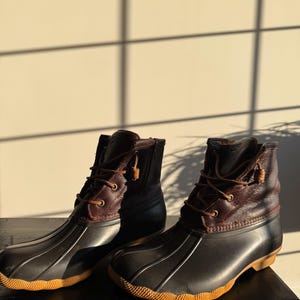 brown and black sperry duck boots