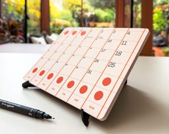 2026 desk calendar, orange • A5 recycled freestanding desktop planner • Stylish packaging