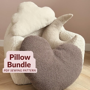 May include: A collection of three decorative pillows featuring a cream-colored cloud, a cream-colored crescent moon, and a dark brown heart. The pillows are made of a textured sherpa-like fabric. Text on the image reads Pillow Bundle PDF SEWING PATTERN.