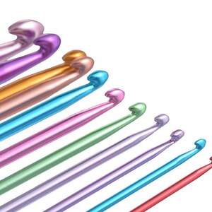May include: A set of ten colorful crochet hooks, arranged in a diagonal line, with the largest hook at the top and the smallest hook at the bottom. The hooks are made of metal and have a shiny finish.