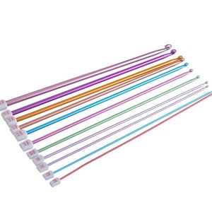May include: A set of 10 colorful aluminum knitting needles with white plastic tips. The needles are labeled with sizes ranging from 2.00 mm to 8.00 mm.