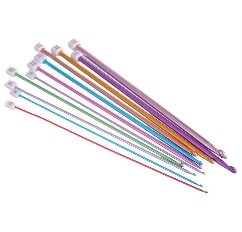 May include: A set of ten colorful knitting needles with white plastic tips. The needles are arranged in a fan shape, with the largest needle at the top and the smallest needle at the bottom. The needles are made of metal and have a smooth, shiny finish.