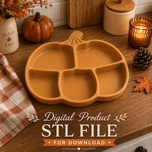 May include: A pumpkin-shaped serving tray with five distinct compartments, finished in a solid matte orange color. The tray features a central stem detail at the top and curved edges defining each section, designed for holding various food items.