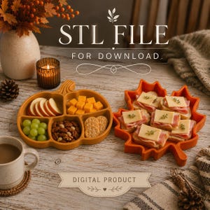 May include: A pumpkin-shaped divided tray and a maple leaf-shaped tray, both orange, containing snacks. Text reads STL FILE FOR DOWNLOAD and DIGITAL PRODUCT. The pumpkin tray holds apple slices, cheese cubes, grapes, nuts, and crackers. The leaf tray holds sandwiches.