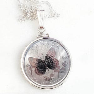 2019 butterfly coin. Canada wildlife treasures coin. Arctic Butterfly necklace. Sterling silver coin bezel. Collectable coin or necklace
