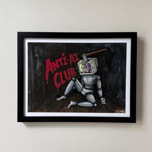 May include: Framed artwork featuring a robot with a TV for a head, holding a hammer. The artwork has the words "ANTI-AI CLUB" in red. The robot is silver and the background is dark.