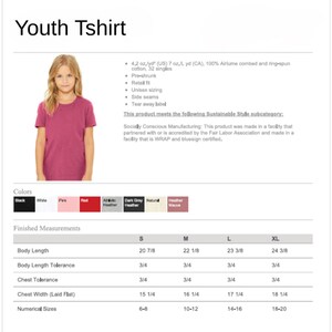a young girl wearing a pink t-shirt, posing for a photograph.