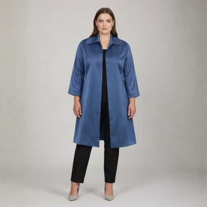 May include: A long, open-front, blue coat with three-quarter sleeves. The coat is paired with black pants and neutral-colored heels. The coat has a classic collar and a flowing silhouette, suitable for various occasions.