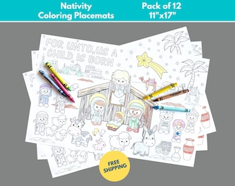 May include: A set of 12 blank Nativity coloring placemats, each measuring 11 inches by 17 inches. The placemats feature a black and white illustration of the Nativity scene with the text "FOR UNTO US A CHILD IS BORN".