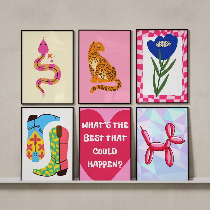 May include: Six framed art prints with colorful illustrations. The prints feature a pink snake, a leopard, a blue flower, cowboy boots, the text "WHAT'S THE BEST THAT COULD HAPPEN?", and a balloon dog. The prints are displayed on a white shelf.