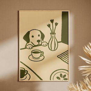 May include: A framed art print featuring a whimsical illustration of a dog peering over a table. The artwork is in shades of green and beige, with a coffee cup, vase of flowers, and a plate. The dog's face is the focal point of the artwork.