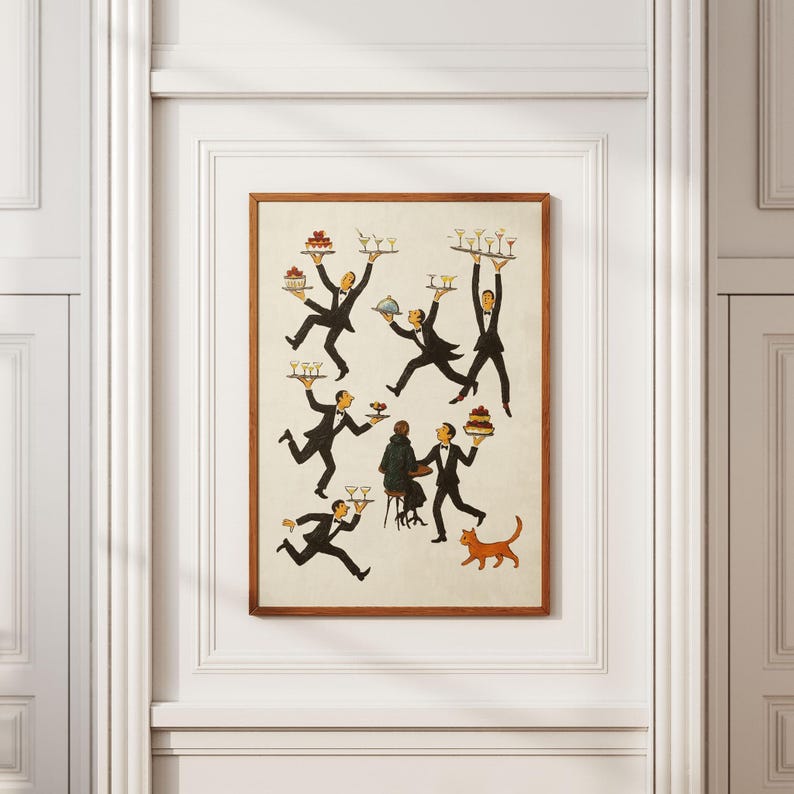 May include: A framed print featuring a whimsical illustration of several waiters in black suits and bow ties, carrying trays of drinks and desserts. A couple sits at a table, and an orange cat walks nearby. The artwork has a vintage aesthetic.
