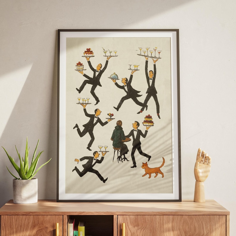 May include: A framed vintage-style print depicts several waiters in black suits carrying trays of drinks and desserts. The illustration has a retro aesthetic, with a cat and a person seated at a table. The color palette is muted, with beige, black, and brown tones.
