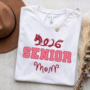 May include: A set of three ceramic mugs with a speckled, matte finish. The mugs are in shades of cream, light gray, and dark gray. Each mug has a simple, minimalist design, perfect for coffee or tea.