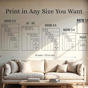 May include: A wall with print size options, including ratios 2:3, 4:5, 3:4, and 1:1, and A1-A4 sizes. The text reads "Print in Any Size You Want." A beige sofa and wooden coffee table are in the foreground.