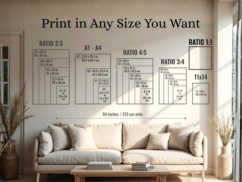 May include: A wall with print size options, including ratios 2:3, 4:5, 3:4, and 1:1, and A1-A4 sizes. The text reads "Print in Any Size You Want." A beige sofa and wooden coffee table are in the foreground.