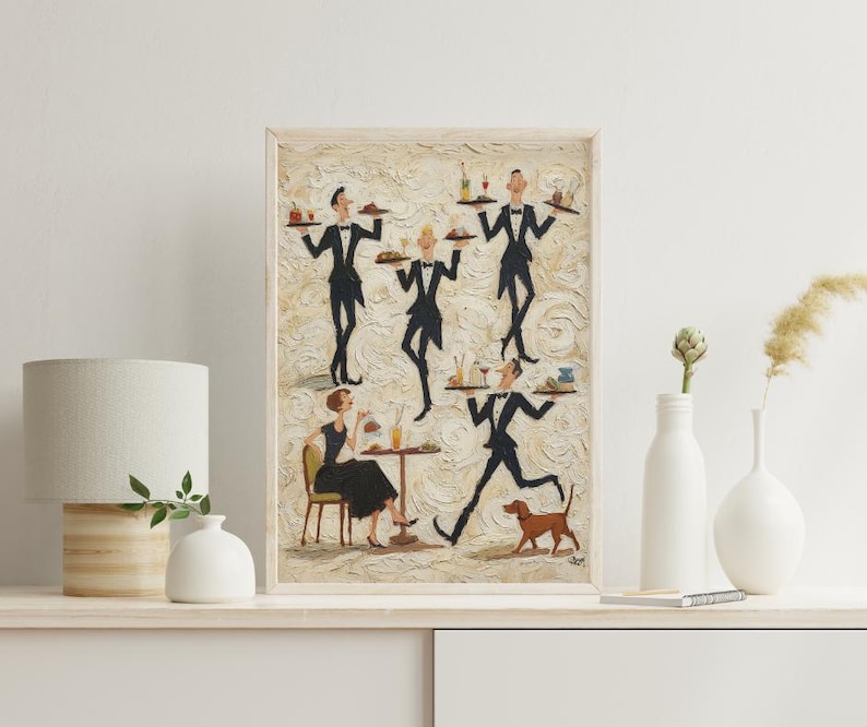 May include: An artistic framed print depicts a restaurant scene with waiters in black suits carrying trays. A woman in a black dress sits at a table. A brown dog runs in the foreground. The artwork has a textured, beige background.