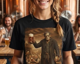 May include: A black t-shirt featuring a graphic print of a monster holding a beer mug in a tavern setting. The shirt is worn by a person holding a wooden serving tray with four glasses of beer, each containing a different shade of golden liquid.