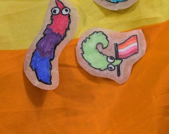 Custom worm on a string pride flag sticker