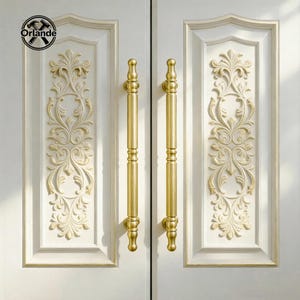 May include: Two white doors featuring gold-coloured handles and ornate floral relief panels. The handles are long, cylindrical, and have decorative finials. The floral panels are in a matching gold colour. The doors have a classic, elegant design.