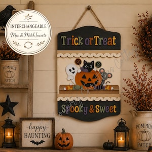 May include: A DIY wood kit featuring a hanging sign with the text Trick or Treat and Spooky & Sweet. The sign displays a painted pumpkin, a black cat, a ghost, and a mouse. The kit includes various wooden cutouts for painting and assembly.