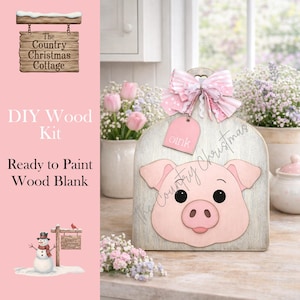 May include: A DIY wood kit featuring a pig design. The wooden blank has a light gray wash and a pink pig face with a bow and tag that says "oink". The Country Christmas Cottage logo is visible.