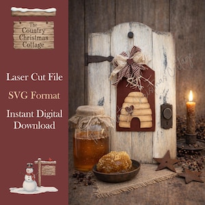 May include: A rustic scene featuring a wooden door with a decorative beehive cutout, a jar of honey, and a bowl of honeycomb. A lit candle and star-shaped ornaments add warmth. The text on the sign reads "The Country Christmas Cottage".