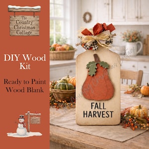 May include: A wooden DIY kit with a pumpkin design and the words "FALL HARVEST". The kit includes a wood blank ready to paint. The image also features pumpkins and fall decor.