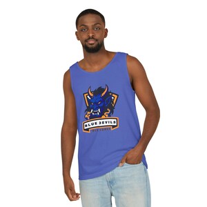 May include: A blue tank top featuring a blue devil graphic with orange accents. The text "BLUE DEVILS OLD FORGE" is displayed below the graphic. The tank top is made of a soft, comfortable material.