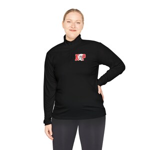 May include: Black long-sleeve quarter-zip pullover with the letters "N" and "P" in red, with a white graphic. The pullover is made of a soft, comfortable material.