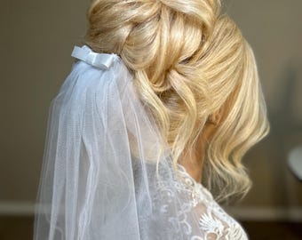 Cathedral veil with dainty satin bow