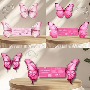 May include: A collection of pink butterfly-themed business cards and butterfly illustrations. The business cards feature the name "Elira Mendez" and the word "SERVICES". The butterflies have pink wings with darker pink accents. The cards and butterflies are arranged on a wooden surface.