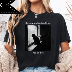 May include: A set of three ceramic mugs with a speckled, matte finish. The mugs are in shades of cream, light gray, and dark gray. Each mug has a simple, minimalist design, perfect for coffee or tea.