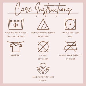 May include: A light pink graphic with care instructions. The text reads "Care Instructions" in elegant script. Symbols indicate machine wash cold, non-chlorine bleach, tumble dry low, hang dry, do not dry clean, and do not iron directly on print. "Handmade with love, enjoy!"