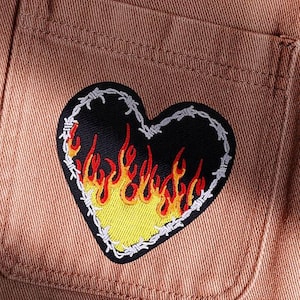 May include: A white ceramic mug with a black handle and the text "But First, Coffee" in a handwritten style. The mug is on a white surface. The mug is approximately 4 inches tall.