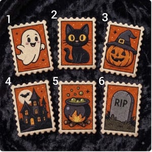 May include: Six rectangular embroidered patches with scalloped edges, each featuring a Halloween theme on an orange background: a white ghost, a black cat, a jack-o'-lantern, a haunted house, a bubbling cauldron, and a tombstone labeled RIP.