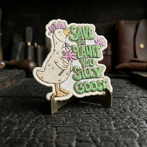 Save The Planet You Silly Goose Patch – Funny Eco Meme Embroidered Iron-On Patch – Cute Environmental Goose Badge for Jacket, Backpack, Hat.