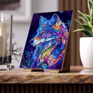 May include: A rectangular art print featuring a stylized wolf portrait in vibrant shades of blue, purple, yellow, and orange. The wolf is depicted with intricate, swirling patterns throughout its fur, set against a dark, deep blue background.