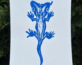 Impression linogravure bleu gecko à deux têtes