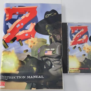May include: A PC CD-ROM game set with an instruction manual and a game case. The manual features the game's logo, a large red "Z", and the title "INSTRUCTION MANUAL". The game case also displays the "Z" logo and the text "A GAME BY THE BITMAP BROS."