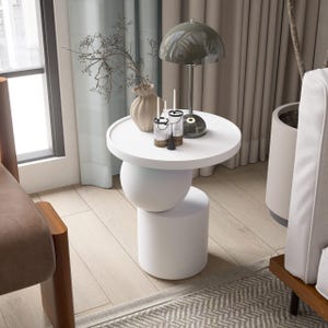 A handmade solid wood side table designed for modern and minimalist interiors. The natural wood surface shows subtle variations that highlight its unique character. Perfect for placing decor items, lighting, or everyday essentials. Ideal for living rooms, bedrooms, or office spaces, offering both functionality and a warm, refined aesthetic.